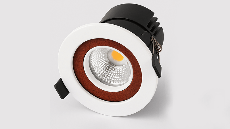 A close-up of a fire rated downlight with its intumescent material visible