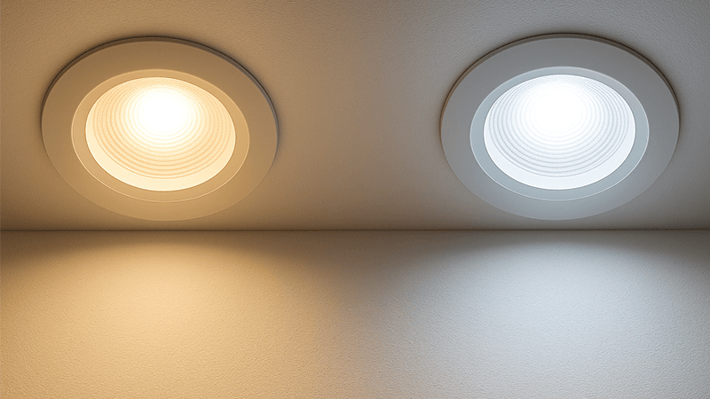 two downlights side-by-side showing different shades of white light