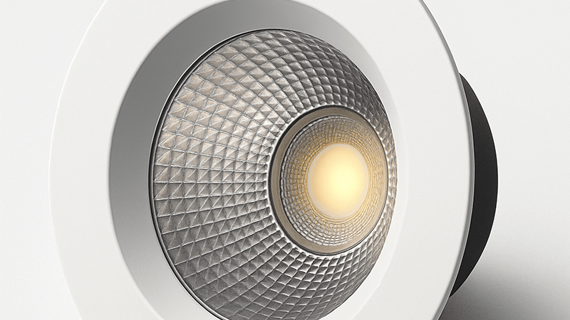 A close-up of a modern LED downlight showing the light source and reflector