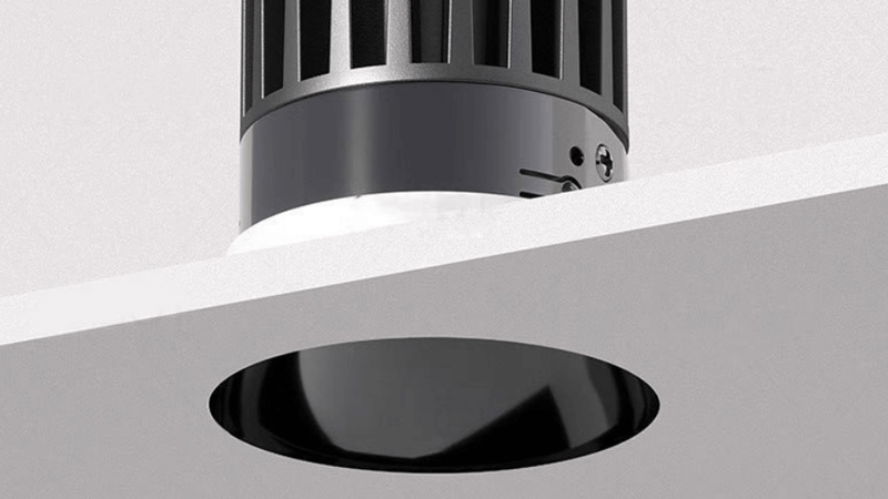 An architectural drawing showing a trimless downlight integrated into the ceiling cross-section