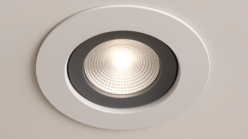A close-up shot of a sleek, modern LED downlight installed in a ceiling