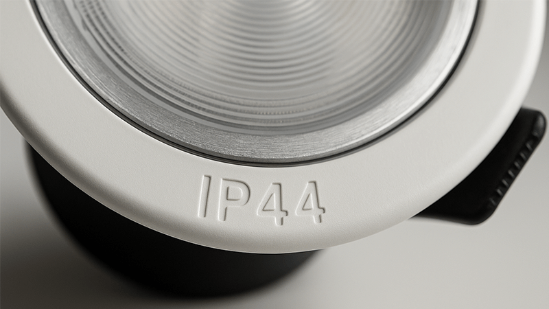 A close-up of an IP44 stamp on a downlight fixture