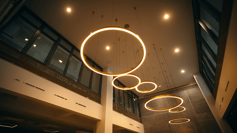 A well-lit high-ceiling space with modern LED downlights
