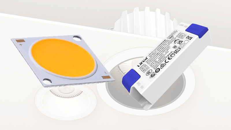 An LED chip and a driver component side-by-side on a workbench