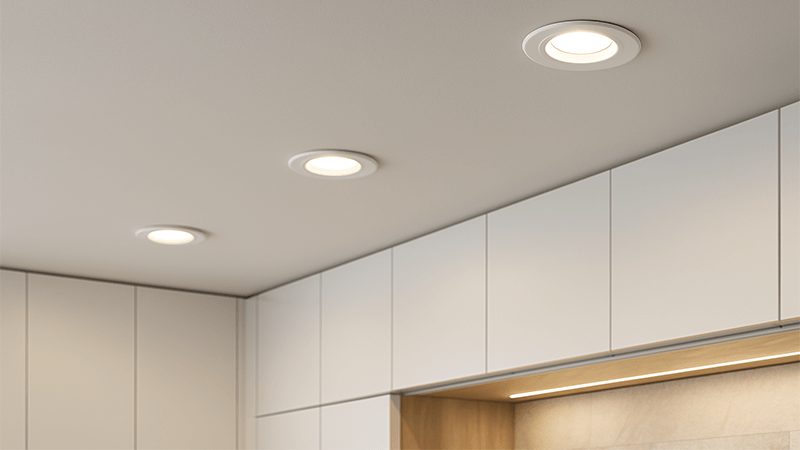 A modern kitchen ceiling with sleek IP44 rated downlights installed
